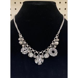 Whimsical necklace adds pizzazz to any outfit! Statement piece w/clasp closure.